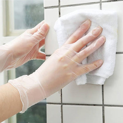 As luvas descartáveis transparentes do vinil trabalham luvas elásticas ácidas do PVC da proteção anti