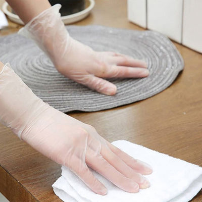 As luvas descartáveis transparentes do vinil trabalham luvas elásticas ácidas do PVC da proteção anti