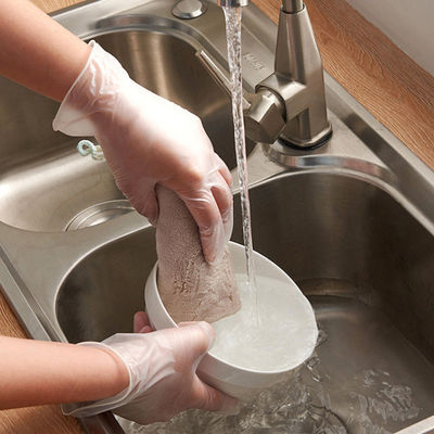 As luvas descartáveis transparentes do vinil trabalham luvas elásticas ácidas do PVC da proteção anti